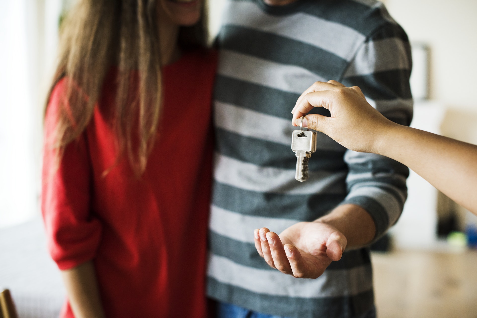 Couple getting keys to their house